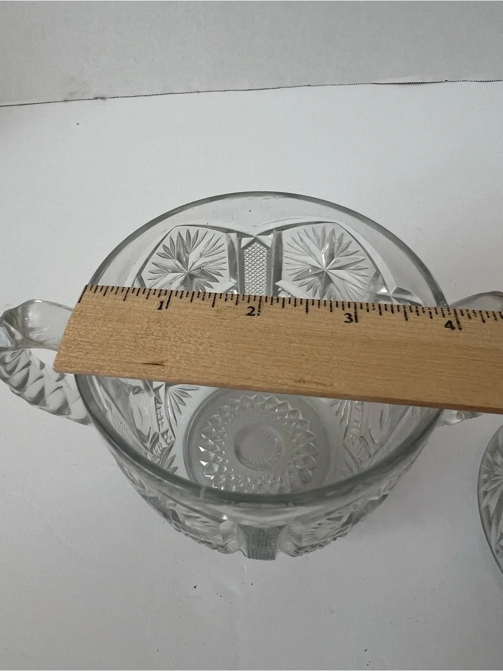 This is a vintage clear pressed-glass covered sugar bowl with 2 handles & lid